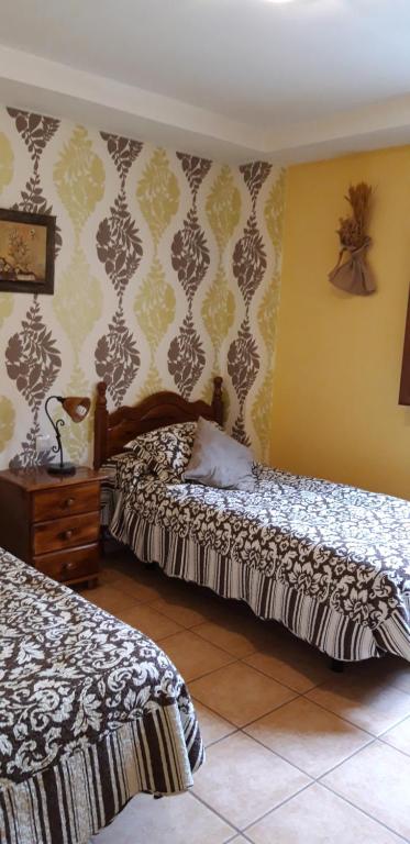 Postel nebo postele na pokoji v ubytování Pozolico Hotel Rural