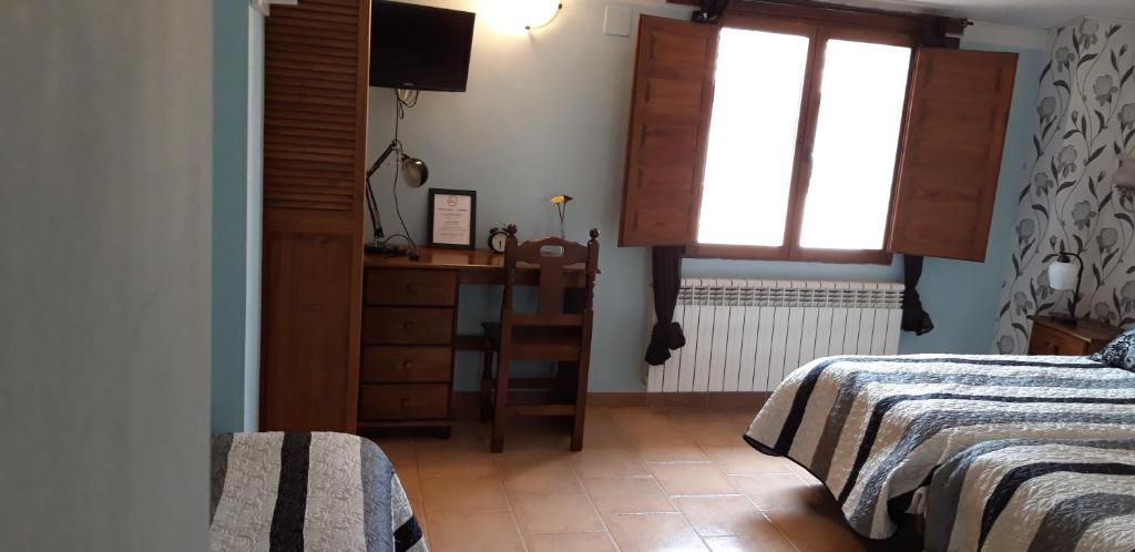 Postel nebo postele na pokoji v ubytování Pozolico Hotel Rural
