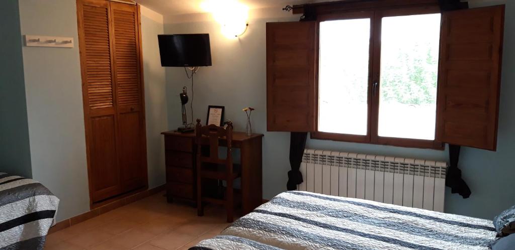 Postel nebo postele na pokoji v ubytování Pozolico Hotel Rural