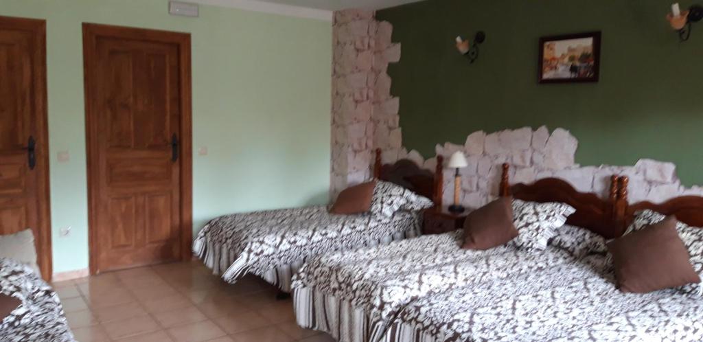 Postel nebo postele na pokoji v ubytování Pozolico Hotel Rural