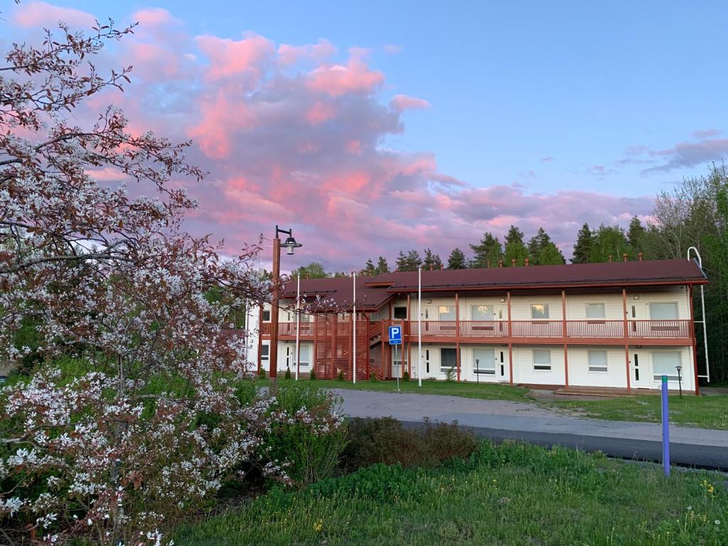 a building with a road in front of it at Rauhan Marinella Village in Imatra