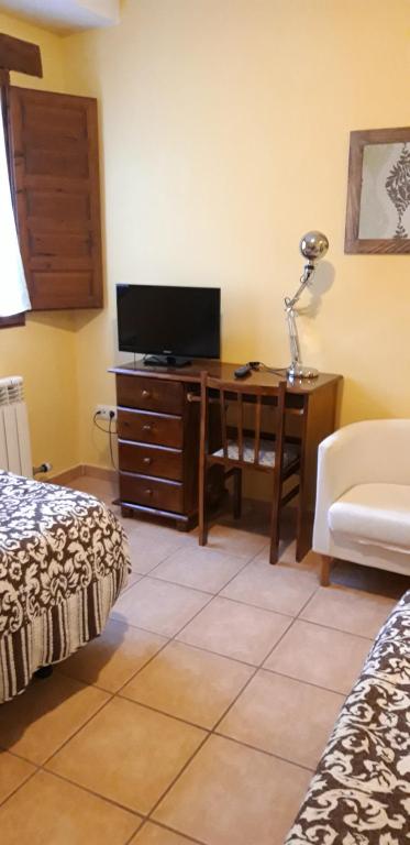 TV a/nebo společenská místnost v ubytování Pozolico Hotel Rural