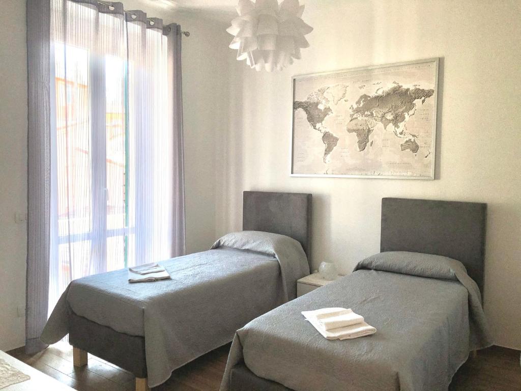 En eller flere senge i et værelse på Mario apartment - Levanto, 5 Terre
