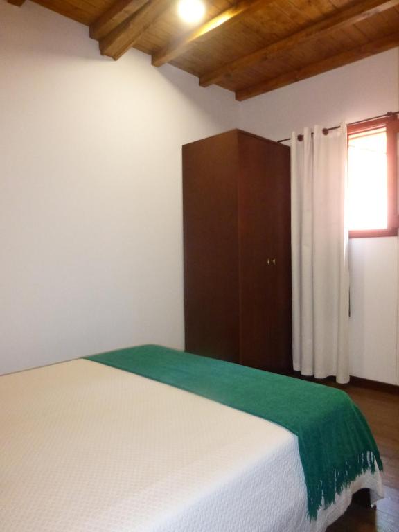Postel nebo postele na pokoji v ubytování Campismo Rural Vale dos Moinhos Gerês