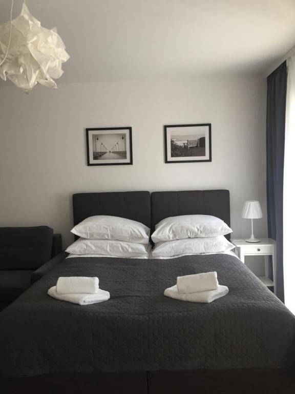 Posteľ alebo postele v izbe v ubytovaní Apartamenty Julia APARTAMENTY OZONOWANE