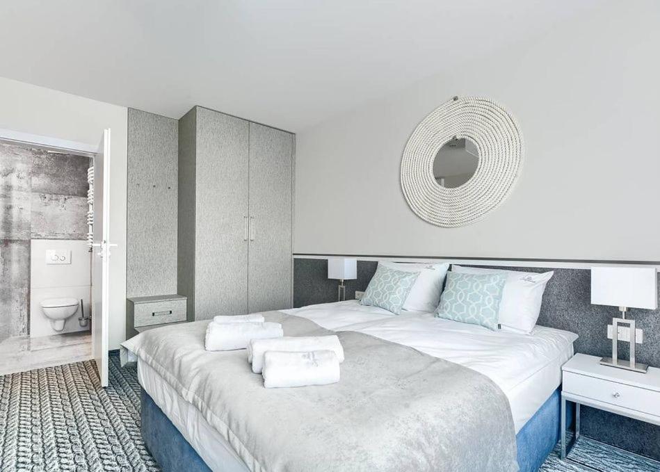 Postel nebo postele na pokoji v ubytování Szymański Holiday Rooms