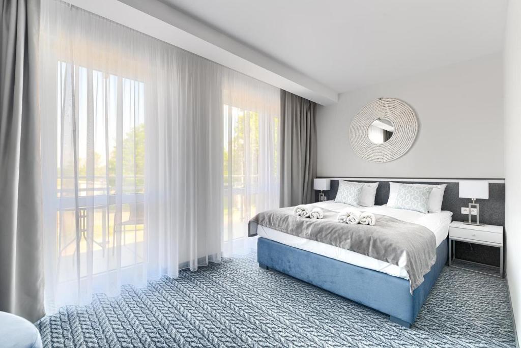 Postel nebo postele na pokoji v ubytování Szymański Holiday Rooms