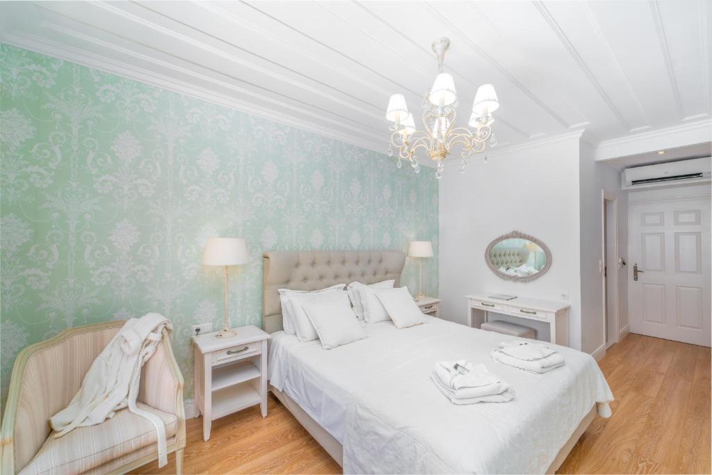 Postel nebo postele na pokoji v ubytování Orion Hotel
