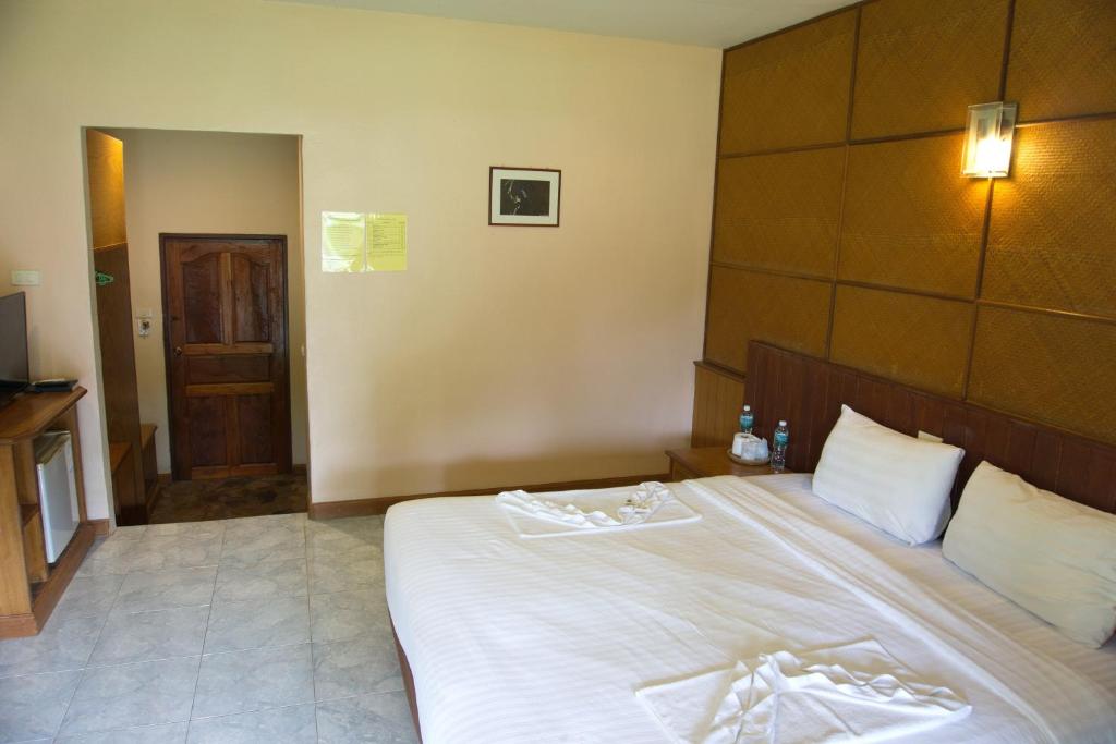Postel nebo postele na pokoji v ubytování Kohchang Privilege