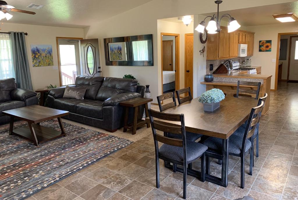 a living room with a table and a couch at GabyHill in Davis