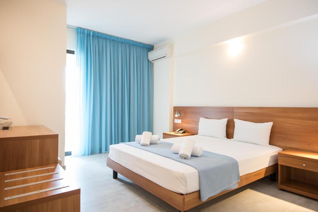 Postel nebo postele na pokoji v ubytování Lido Hotel