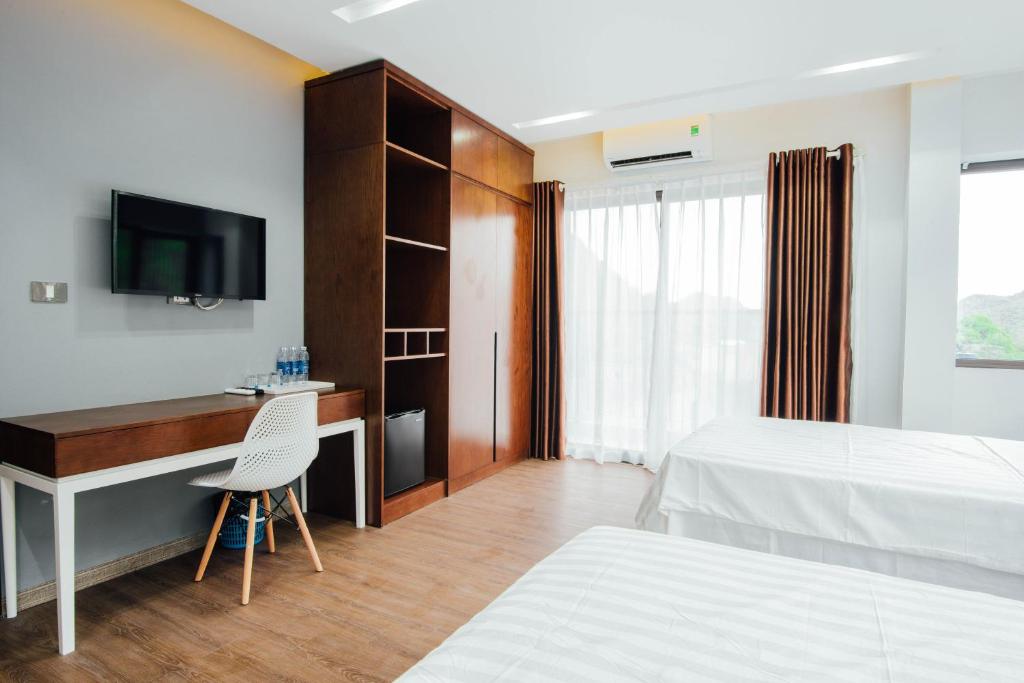 Postel nebo postele na pokoji v ubytování Catba Buffalo Hostel