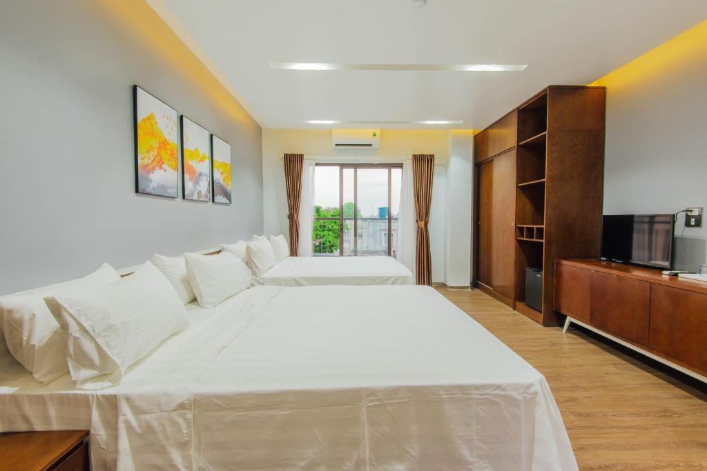 Postel nebo postele na pokoji v ubytování Catba Buffalo Hostel