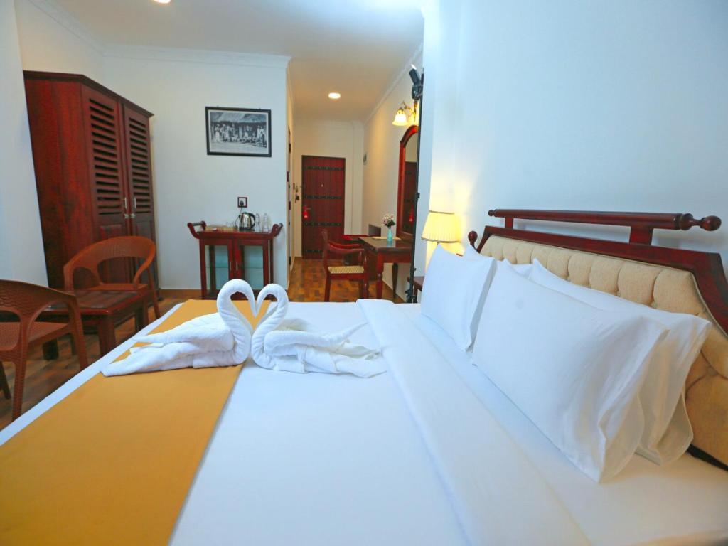 Postel nebo postele na pokoji v ubytování Centauria Hill Resort