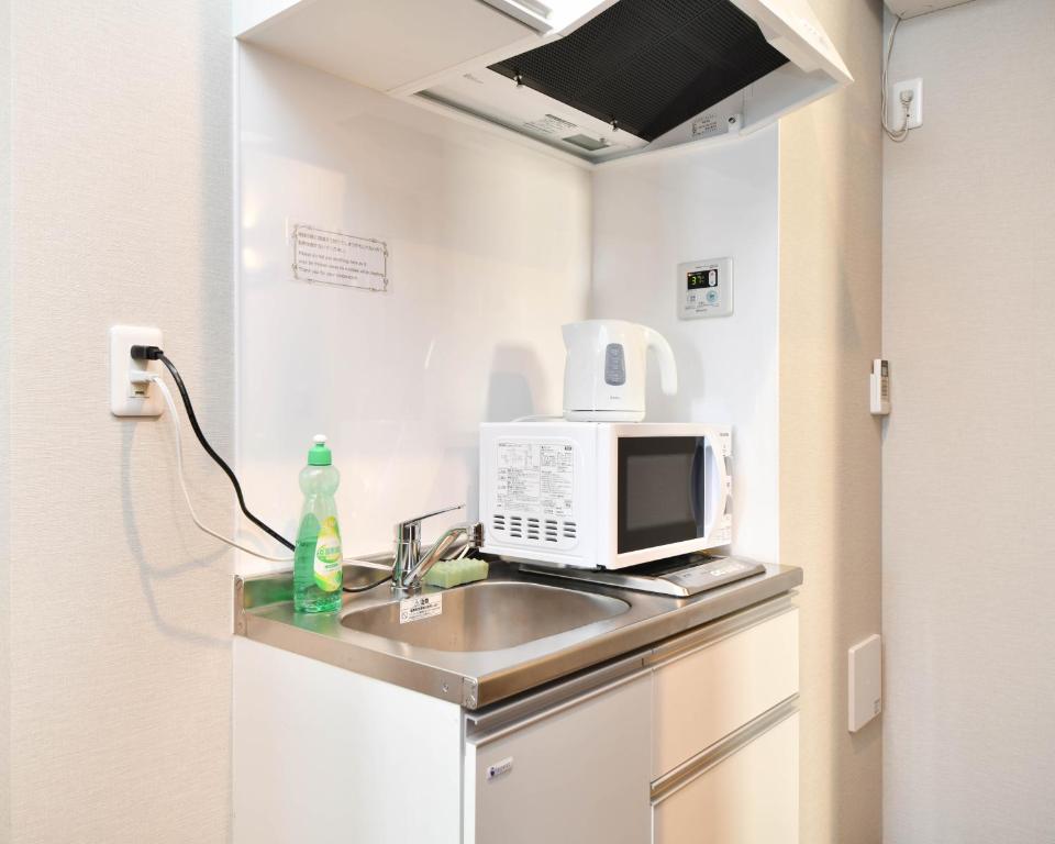 Kuchyň nebo kuchyňský kout v ubytování H2O STAY Ōtorii - Male Only