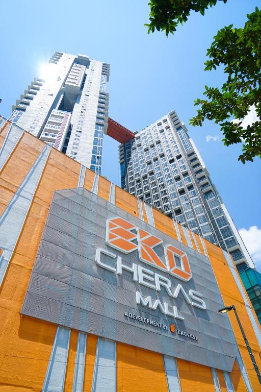 a sign on the side of a building with tall buildings at Ekocheras @ Kuala Lumpur in Kuala Lumpur