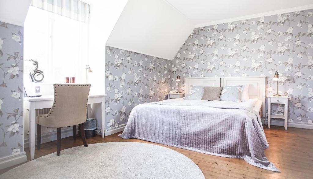 Postel nebo postele na pokoji v ubytování Rånäs Slott