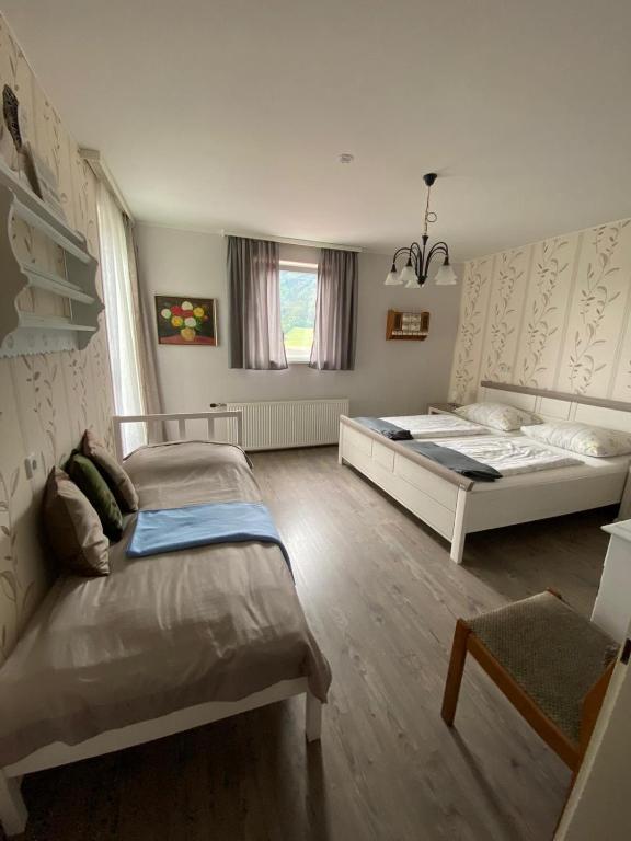 Postel nebo postele na pokoji v ubytování Gasthaus Zum Stadtwald