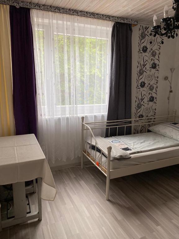 Postel nebo postele na pokoji v ubytování Gasthaus Zum Stadtwald