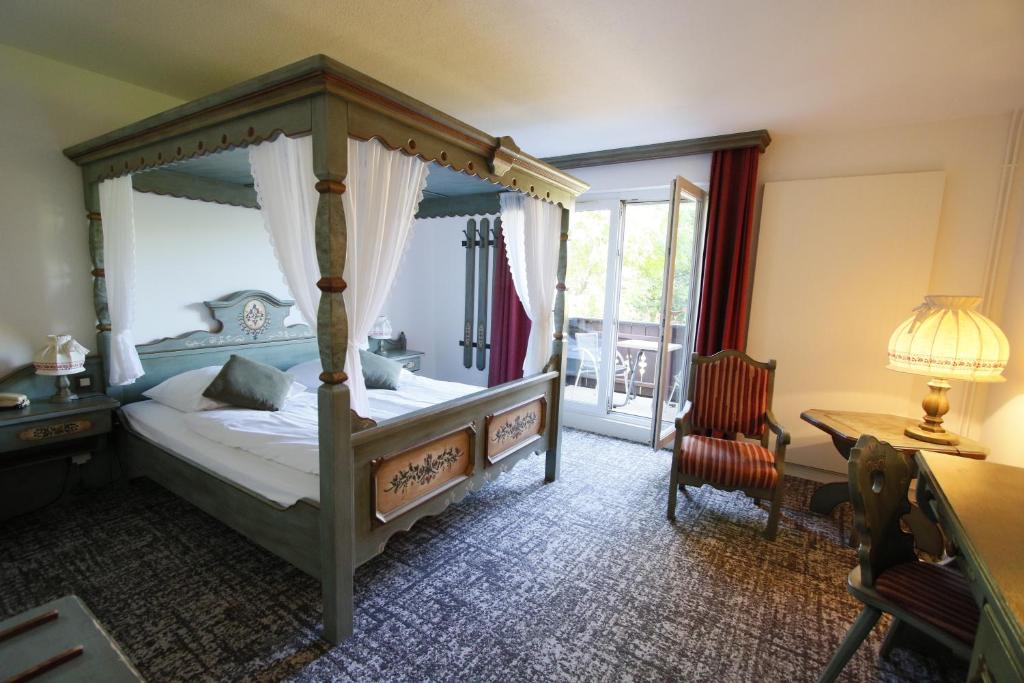 En eller flere senge i et værelse på Les Portes de la Vallee