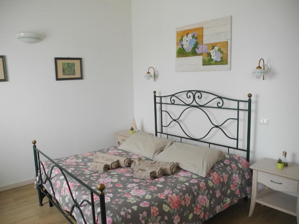 Posteľ alebo postele v izbe v ubytovaní B&B Mimosa e Lillà