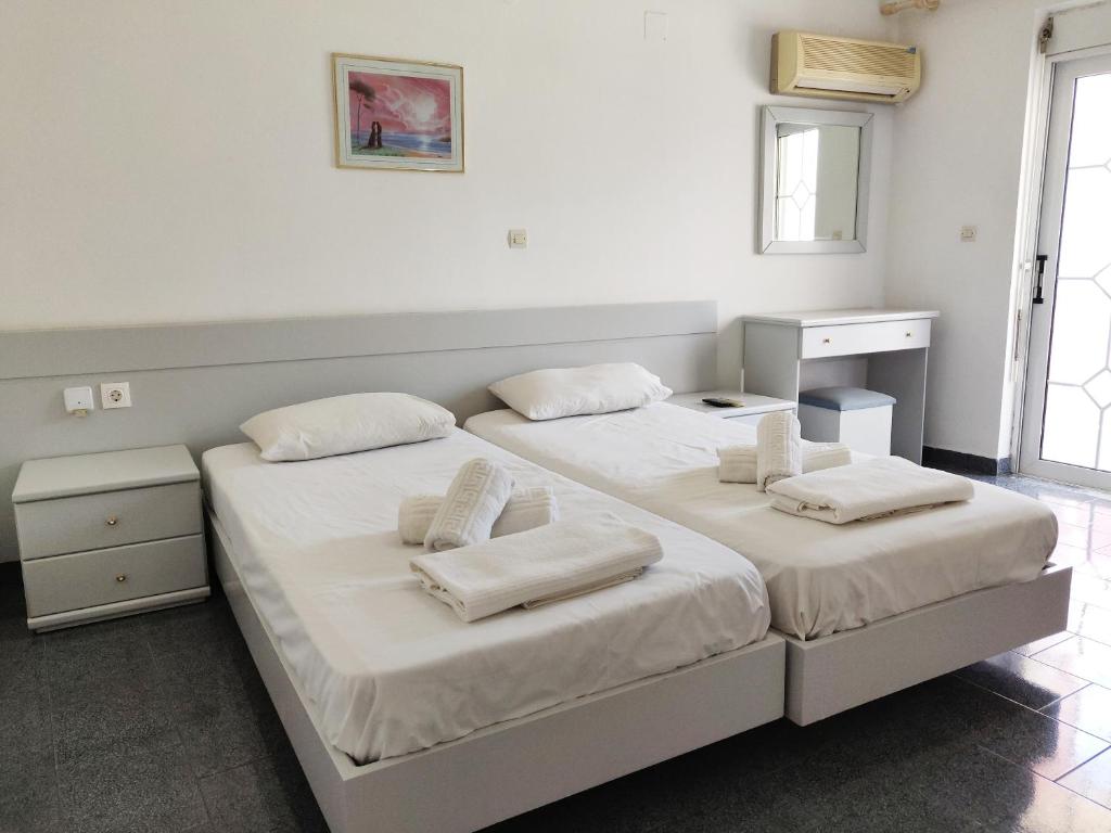 Postel nebo postele na pokoji v ubytování Atrium Apartment #1