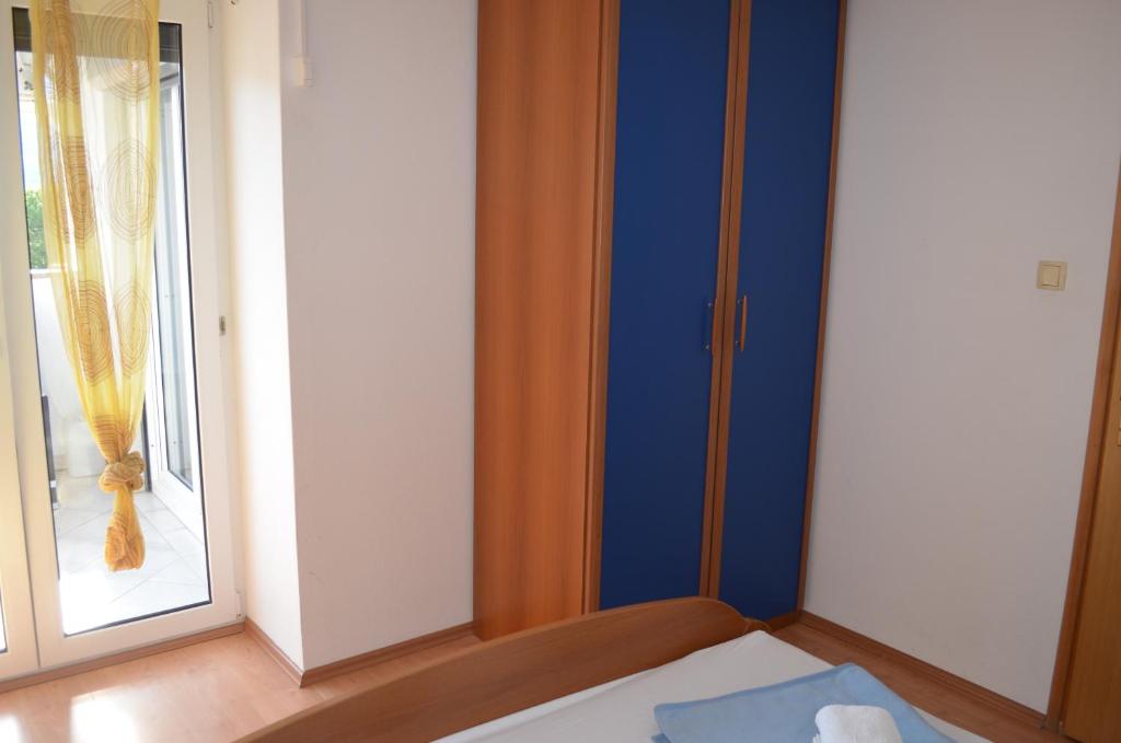 Łóżko lub łóżka w pokoju w obiekcie Apartments Leticia I