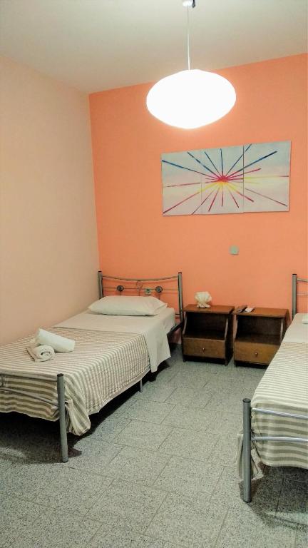 Posteľ alebo postele v izbe v ubytovaní Adonis Villa