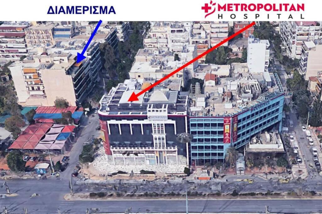 Nespecifikovaný výhled na destinaci Pireus nebo výhled na město při pohledu z apartmánu