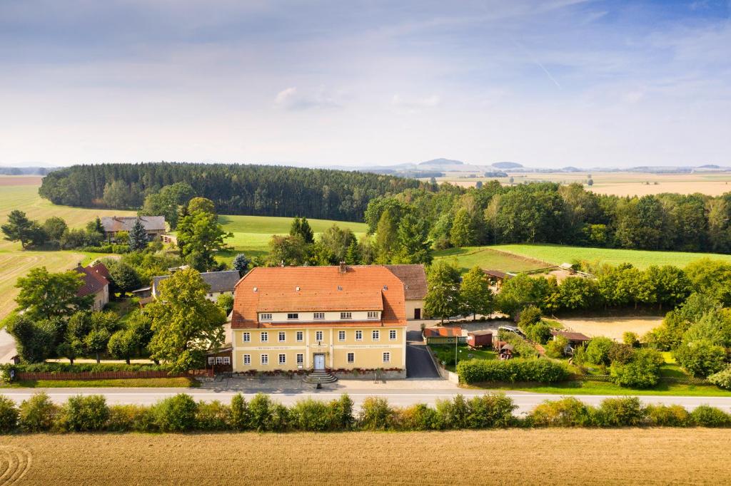 an aerial view of a large house in a field at Landhotel Eulkretscham in Euldorf