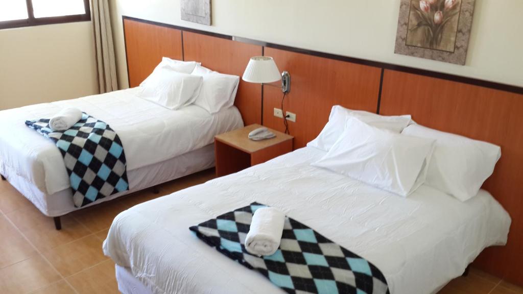 Postel nebo postele na pokoji v ubytování Express Inn Coronado & Camping