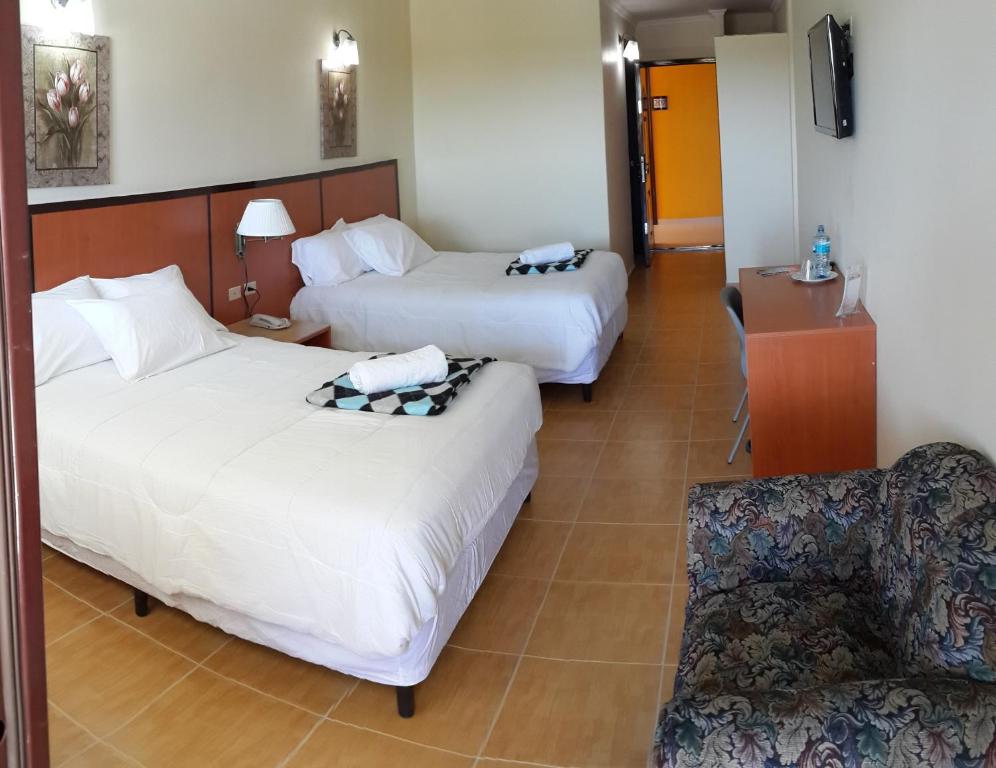 Postel nebo postele na pokoji v ubytování Express Inn Coronado & Camping