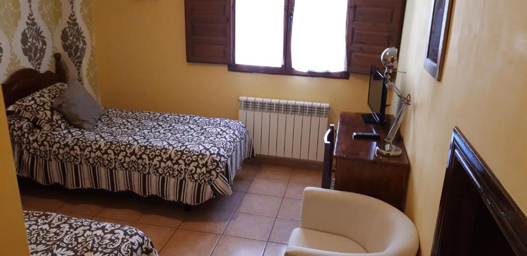 Postel nebo postele na pokoji v ubytování Pozolico Hotel Rural
