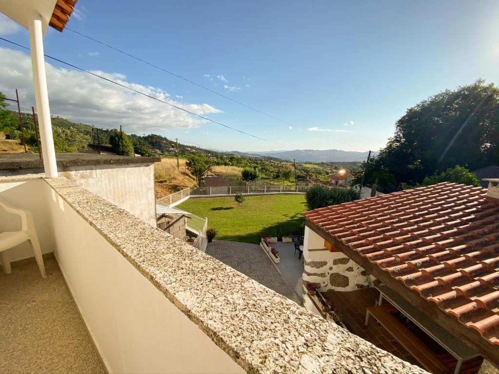 a view of a yard from the balcony of a house at Casa Leite in Amarante