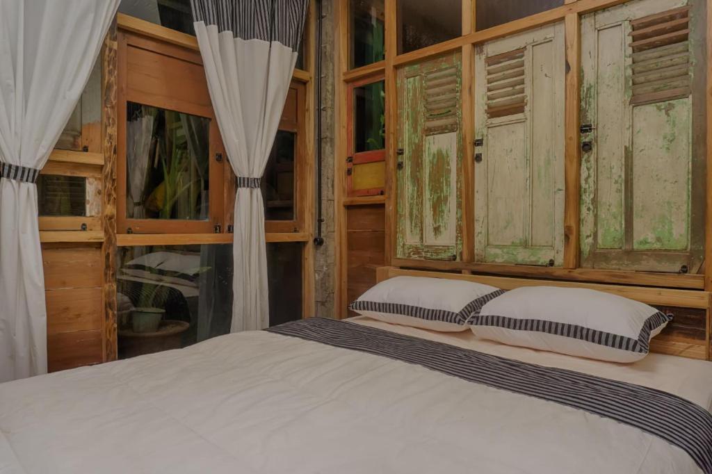 Postel nebo postele na pokoji v ubytování Lorong Homestay