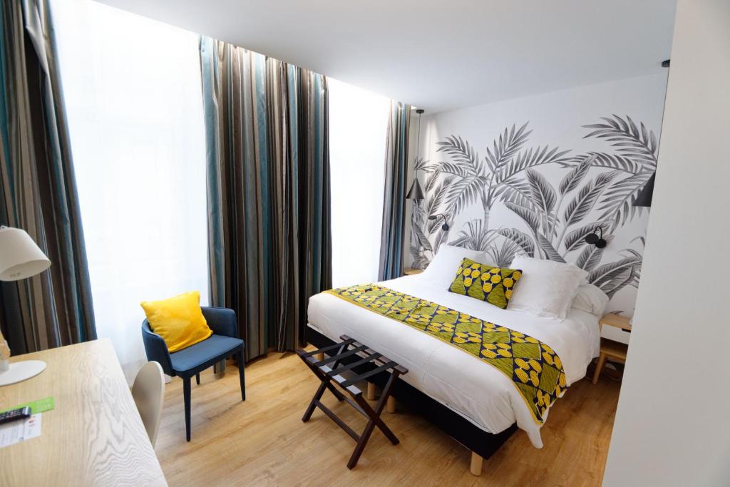 Postel nebo postele na pokoji v ubytování Hôtel Moderna