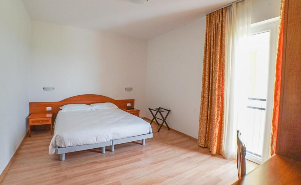 Postel nebo postele na pokoji v ubytování Hotel Nuova Barcaccia