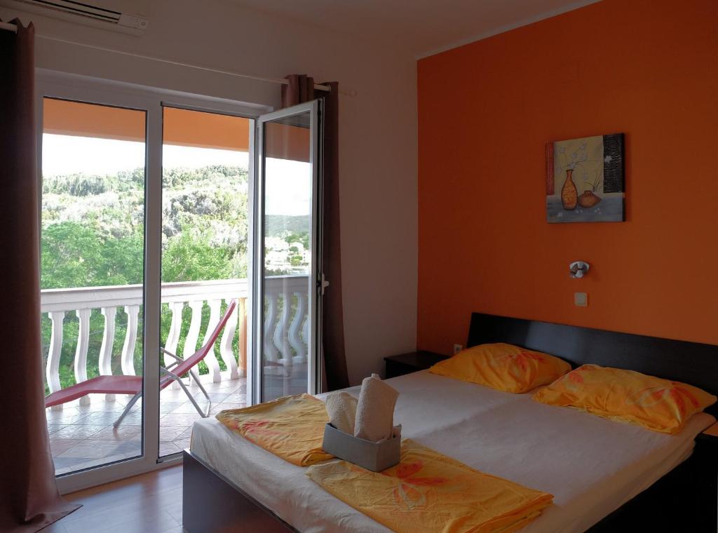 Postel nebo postele na pokoji v ubytování Apartman Precca