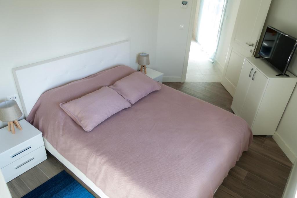 Voodi või voodid majutusasutuse Apartments SLAVA toas