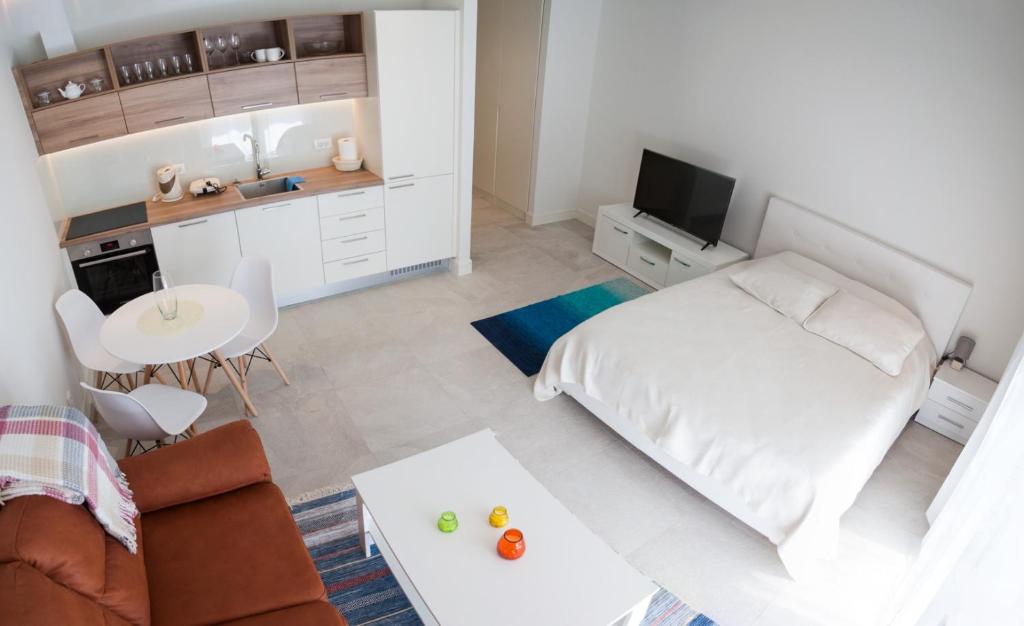 Voodi või voodid majutusasutuse Apartments SLAVA toas