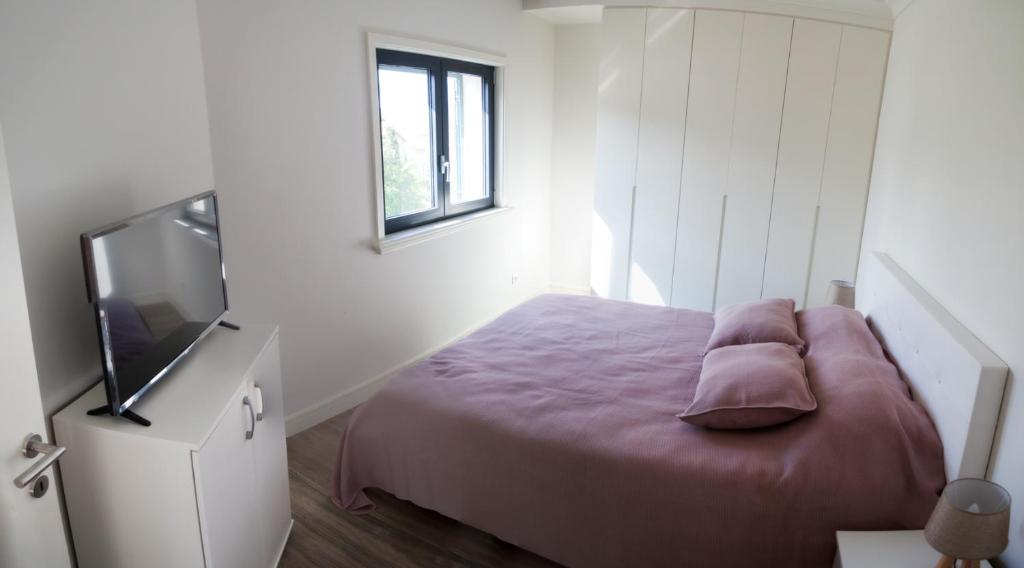 Voodi või voodid majutusasutuse Apartments SLAVA toas