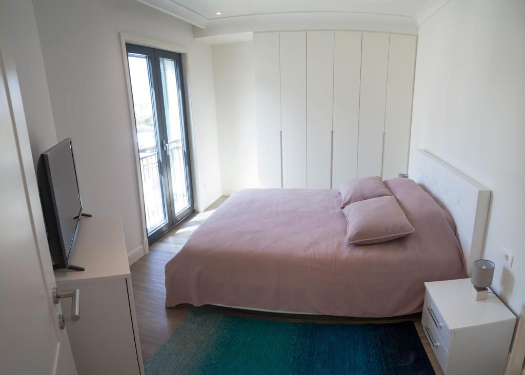 Voodi või voodid majutusasutuse Apartments SLAVA toas