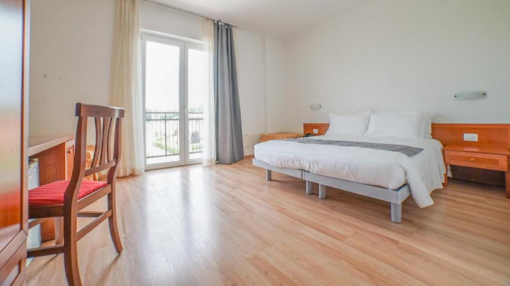 Postel nebo postele na pokoji v ubytování Hotel Nuova Barcaccia