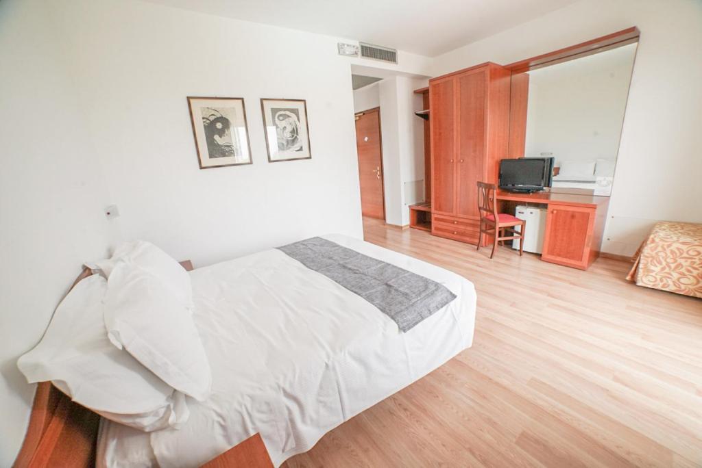 Postel nebo postele na pokoji v ubytování Hotel Nuova Barcaccia