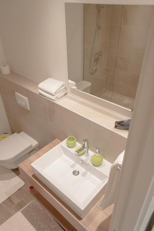 Vannituba majutusasutuses Apartments SLAVA
