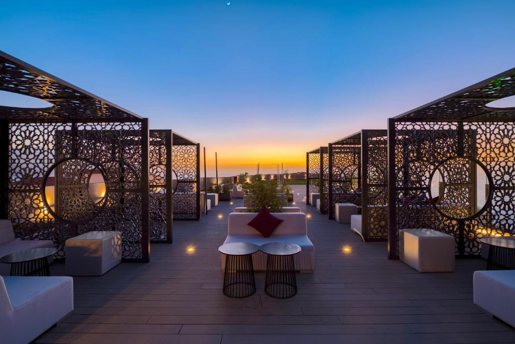 a view of a rooftop patio with a table and lights at Occidental Roca Negra - Adults Only in Agaete