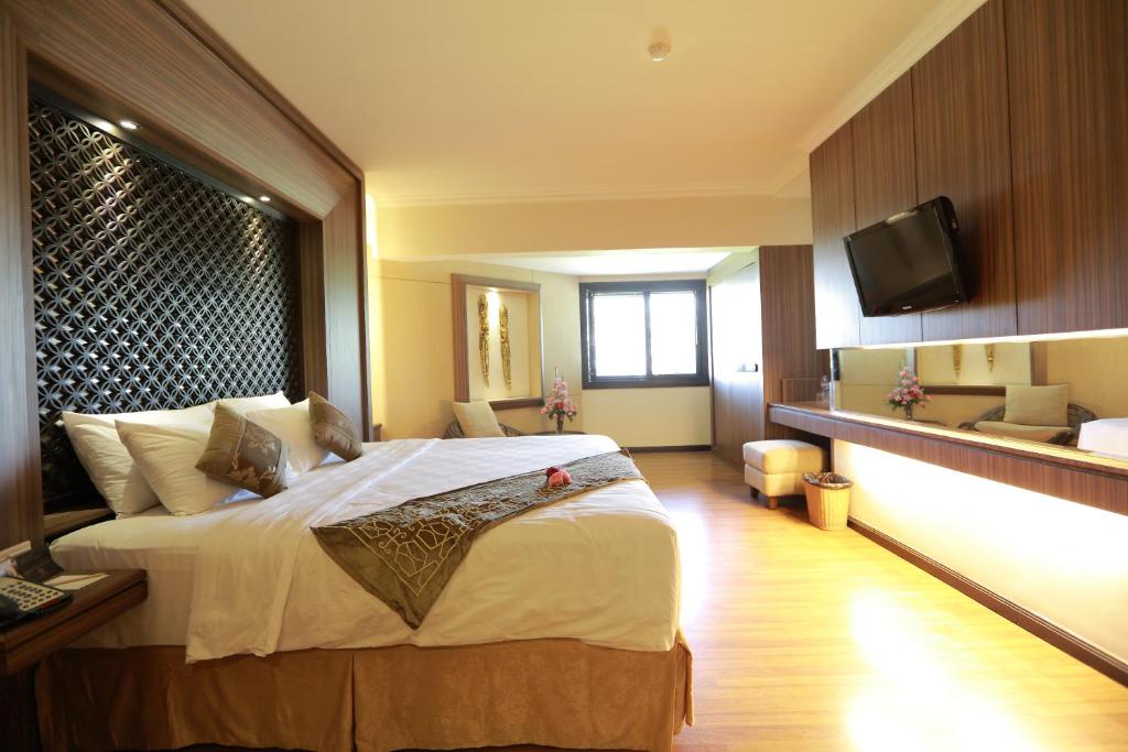 Postel nebo postele na pokoji v ubytování The Singhasari Resort Batu