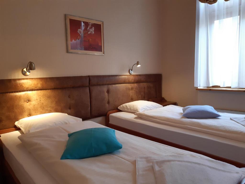 En eller flere senge i et værelse på Kazimierz Secret