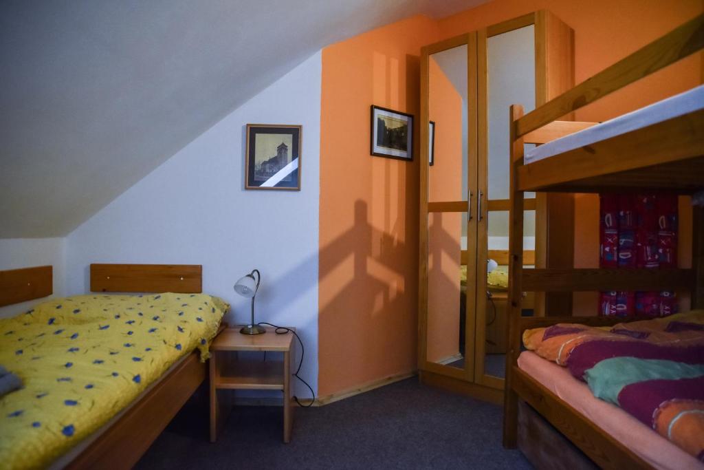 Postel nebo postele na pokoji v ubytování Penzion Čas