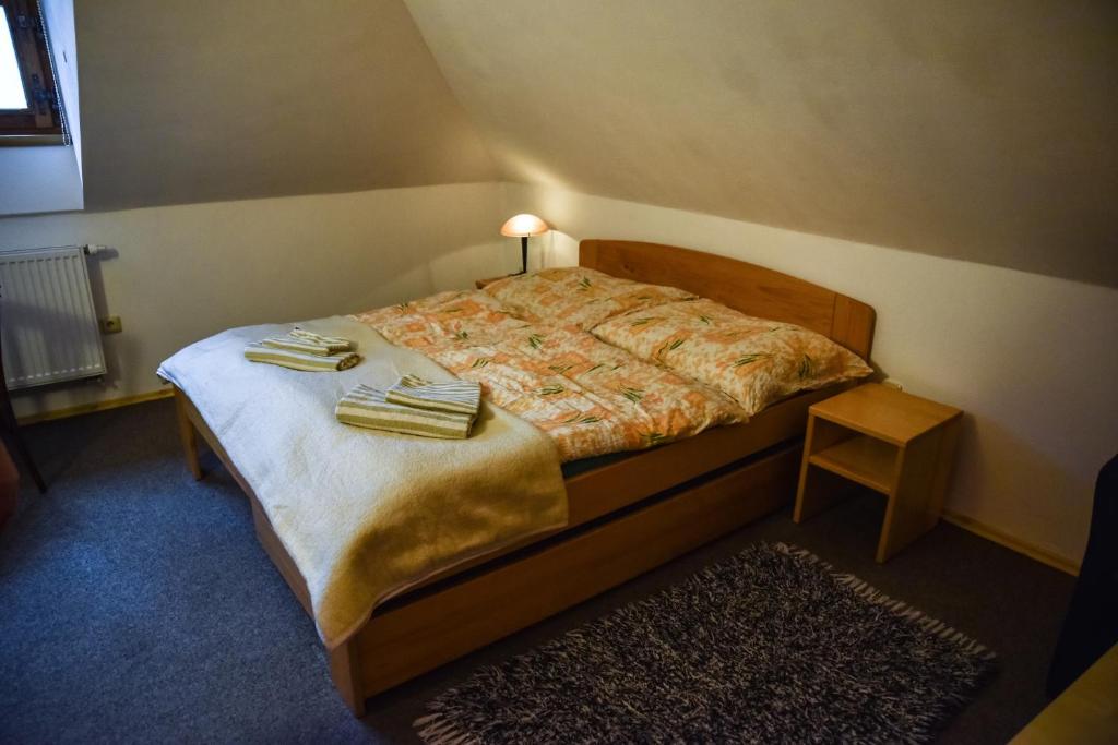 Postel nebo postele na pokoji v ubytování Penzion Čas